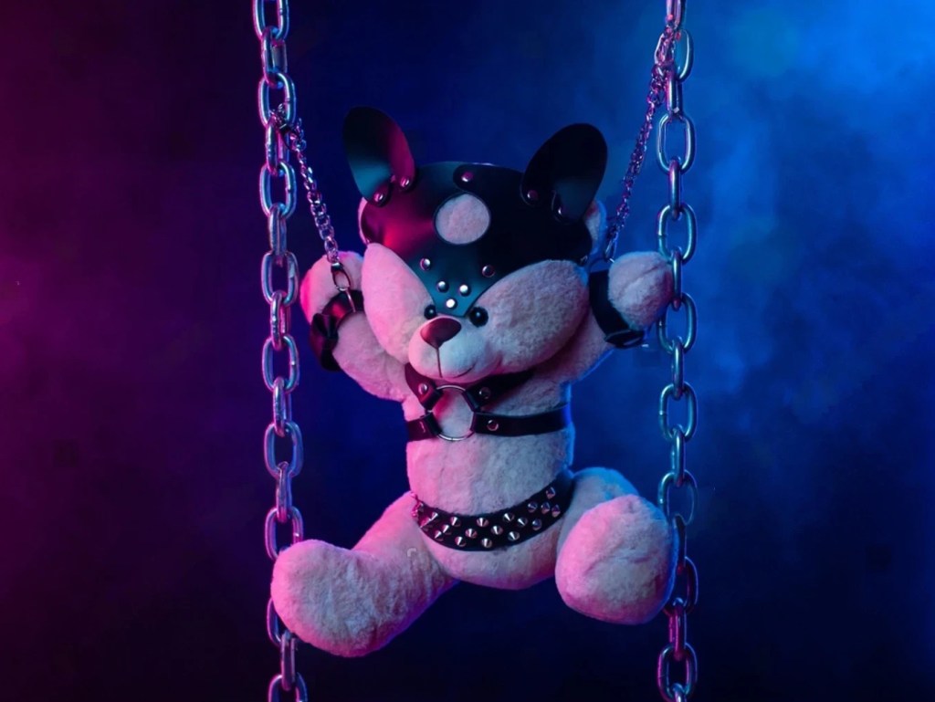 Shows events held, by advertising restraints and bdsm chains on a teddy bear in a light hearted funny way.